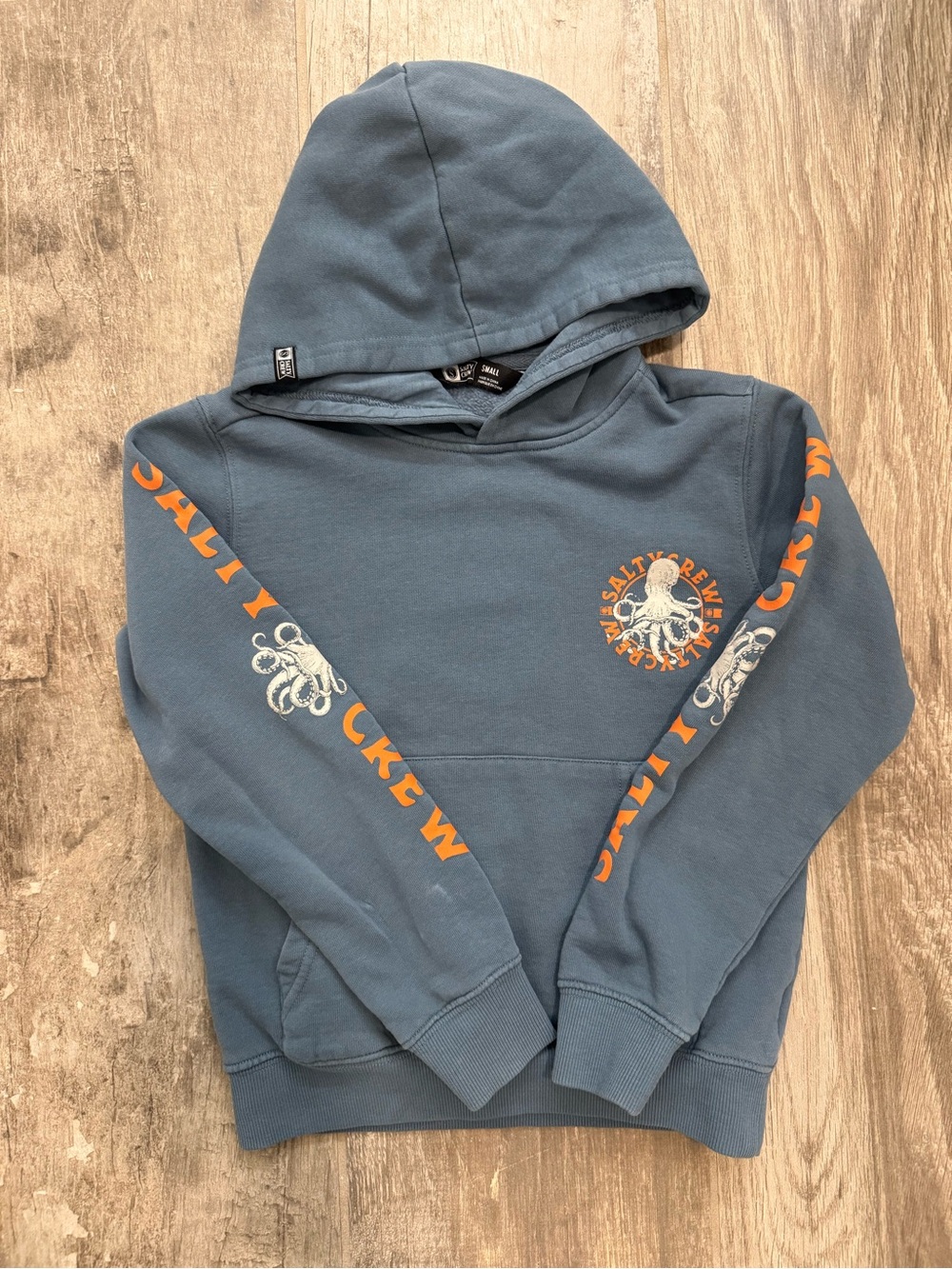 Salty Crew Blue Kids Hoodie with Orange Octopus Sleeve Logo